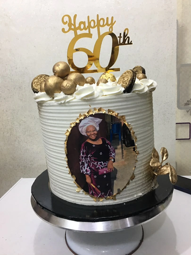 8-Inch Deluxe Buttercream Cake with gold acrylic topper, chocolate spheres, and edible portrait frame