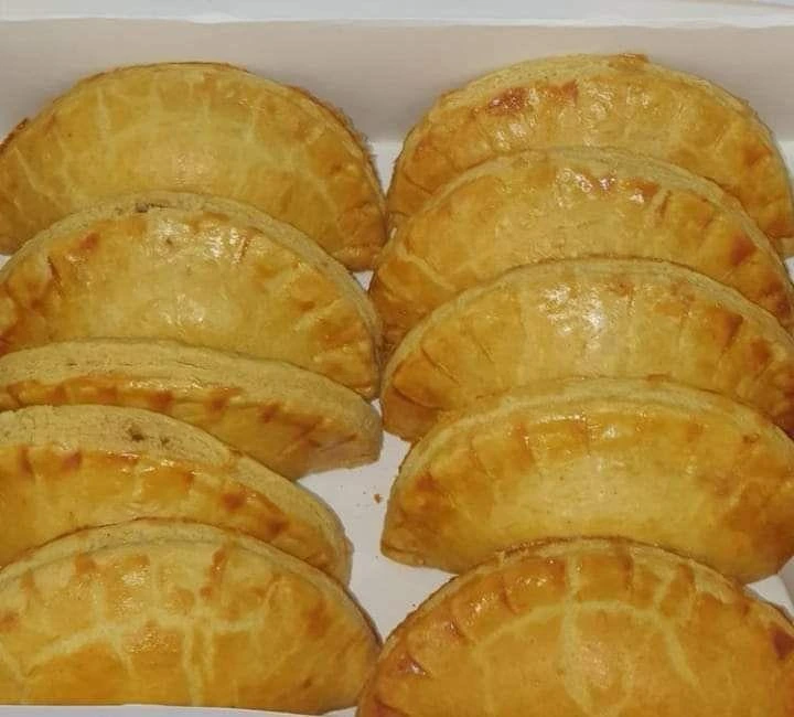 Freshly baked Nigerian meat pies with seasoned minced beef filling
