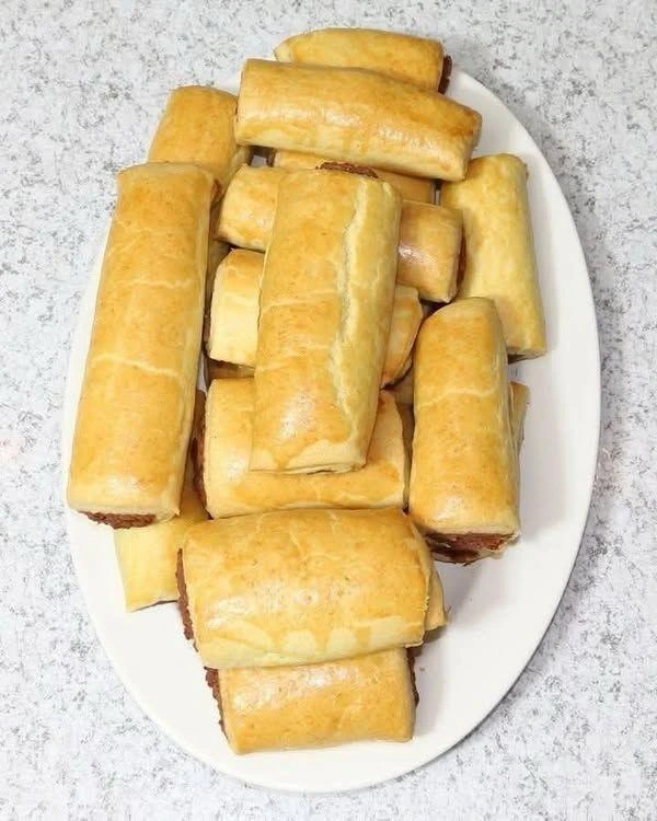 Fresh medium size pastries, sausage rolls and savory baked snacks
